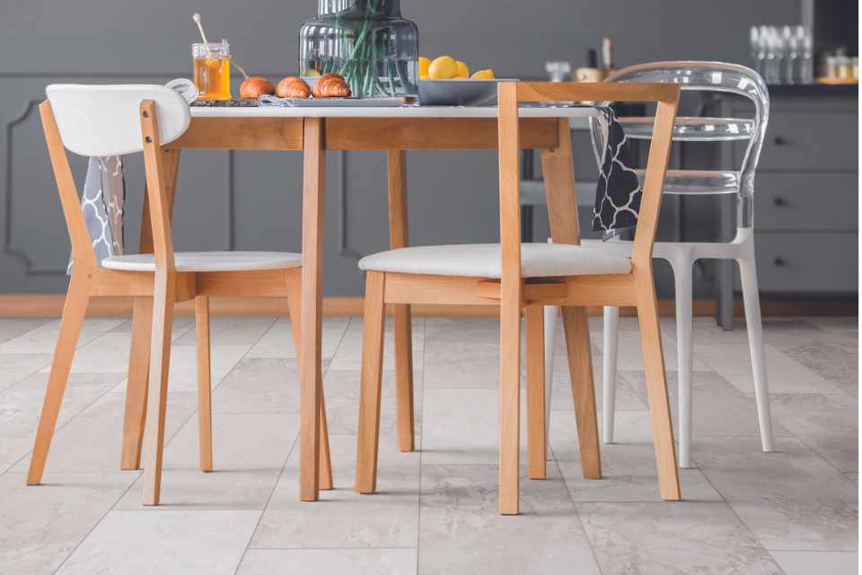 stone look luxury vinyl tile in dining room with gray accents